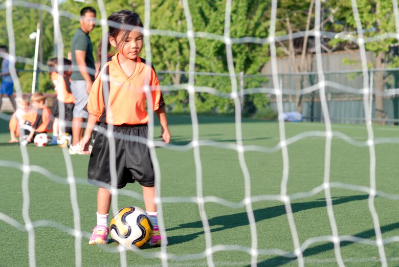 Kaitlyn Hsu, daughter of Capt. Chin Hsu, warms up before her team’s first youth soccer game at Osan Air Base, Republic of Korea, Sept. 25, 2013. Youth sports are made possible by dedicated volunteer coaches from the base community. If interested in volunteering for seasonal youth sports, contact the director of youth sports by emailing matthew.sharman@us.af.mil. (U.S. Air Force photo/1st Lt. Kay M. Nissen)