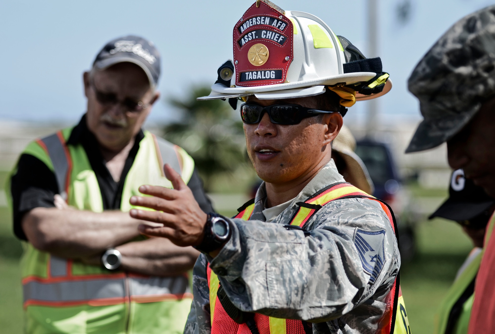 Master Sgt. Francis Tagalog, 36th Civil Engineer Squadron Fire and Emergency Services incident commander for the event, thanks the participating agencies after completing the field training exercise portion of the annual multi-agency fuel spill response training event Sept. 26, 2013, at the 36th Logistics Squadron Fuels Management Flight compound on Andersen Air Force Base, Guam. More than 29 people from a total of eight agencies participated in the exercise, to include representatives from 36th Medical Group, 36th LRS, 36th Security Forces Squadron and DZSP-21. (U.S. Air Force photo by Senior Airman Marianique Santos/Released) 