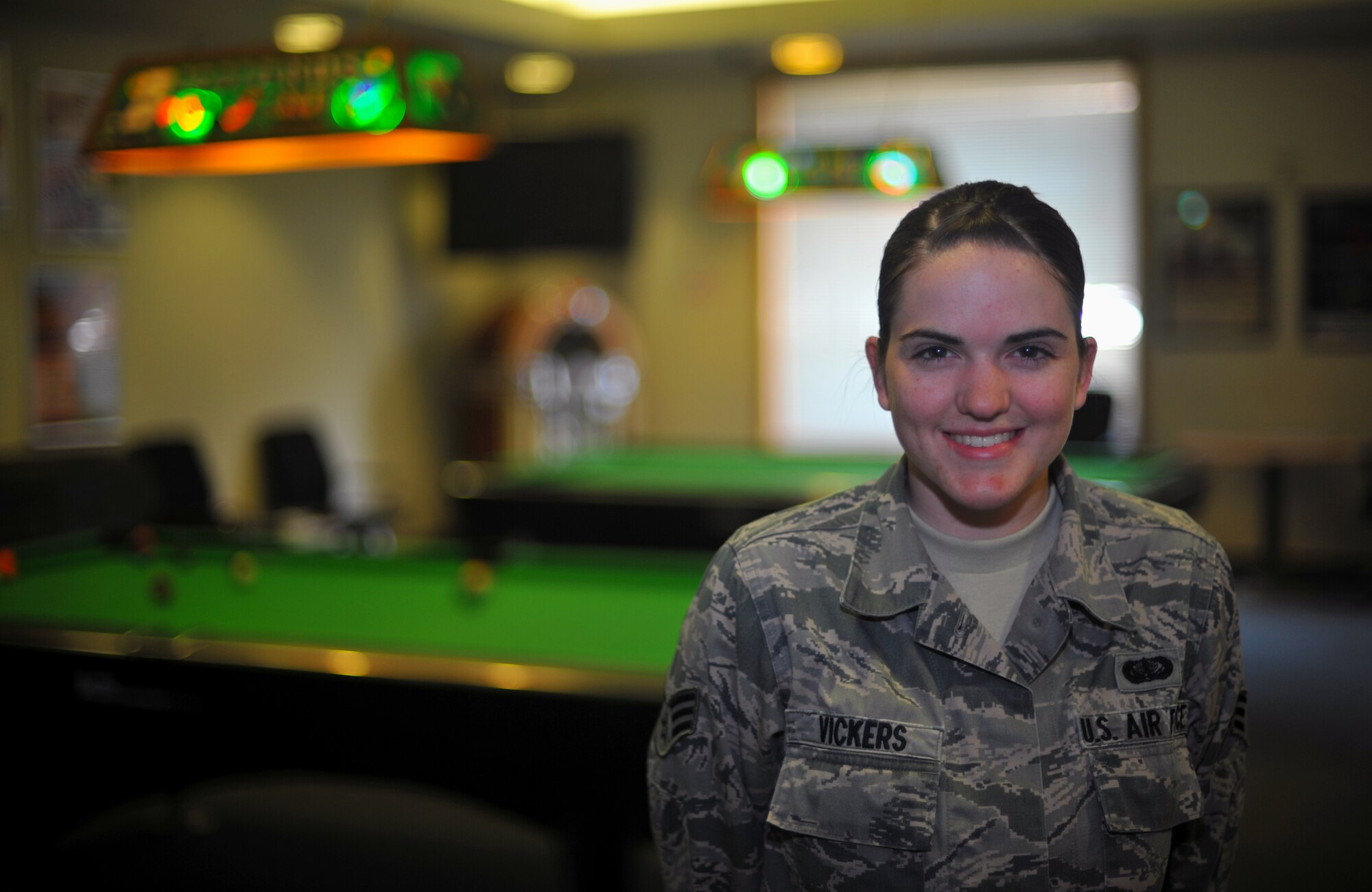 Senior Airman Teya Vickers, 51st Force Support Squadron recreation assistant, poses for a photo at the Community Center on Osan Air Base, Republic of Korea, Sept. 25, 2013. Vickers is the week’s Airman Spotlight winner. (U.S. Air Force photo/Senior Airman Siuta B. Ika)