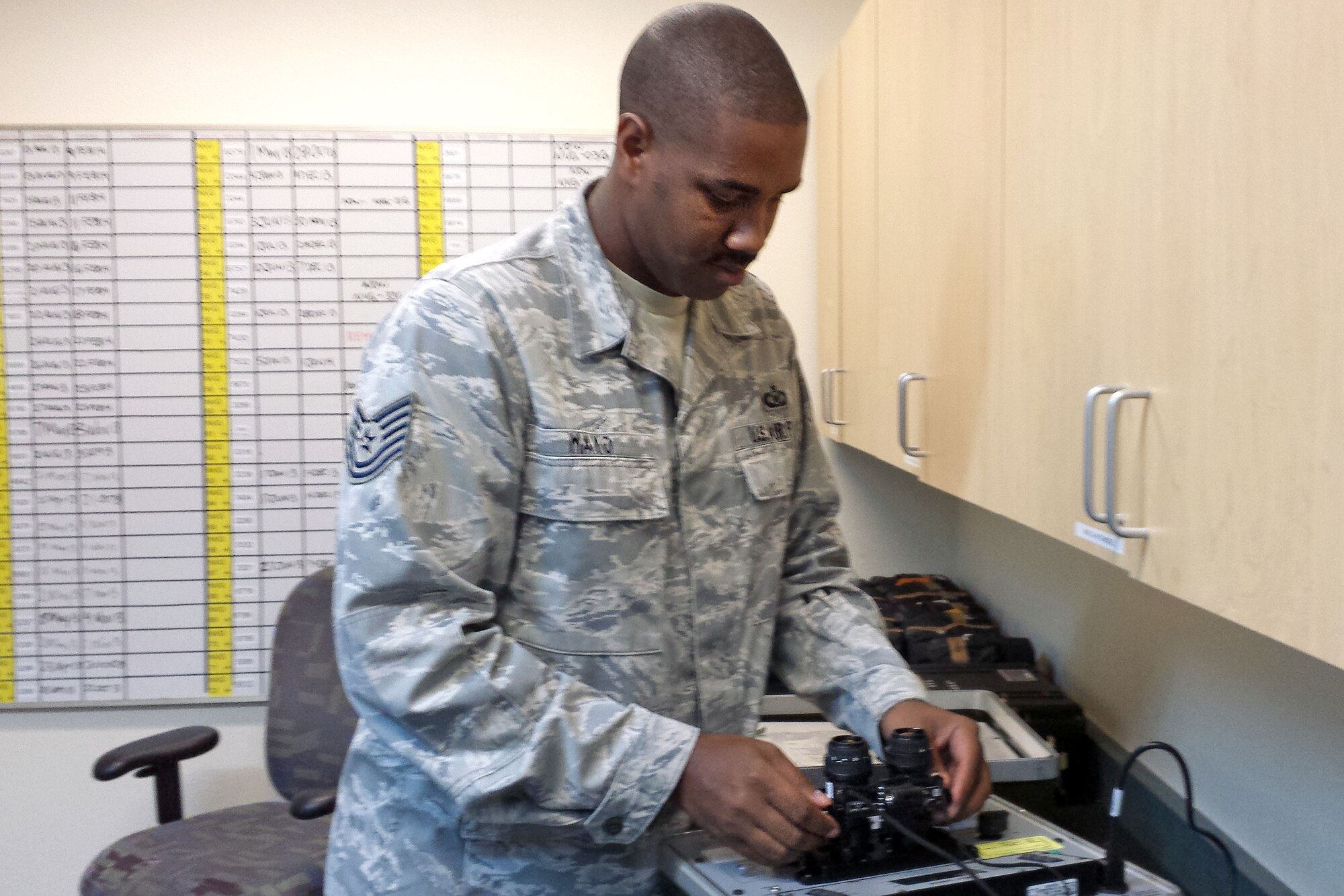 Tech.Sgt. Steven Mayo, 912th Air Refueling Squadron aircrew flight equipment NCO in charge, inspects equipment at March Air Force Base, Calif., Sept. 3, 2013. Mayo has been selected as Fairchild's Finest. (Courtesy Photo)
