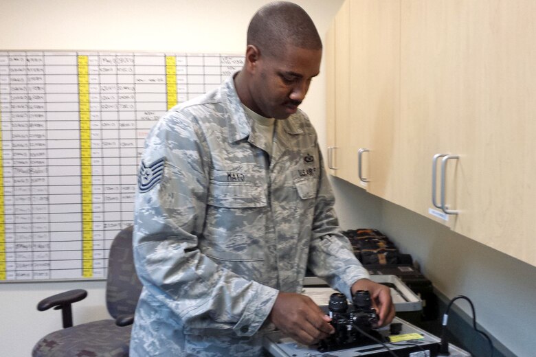 Tech.Sgt. Steven Mayo, 912th Air Refueling Squadron aircrew flight equipment NCO in charge, inspects equipment at March Air Force Base, Calif., Sept. 3, 2013. Mayo has been selected as Fairchild's Finest. (Courtesy Photo)