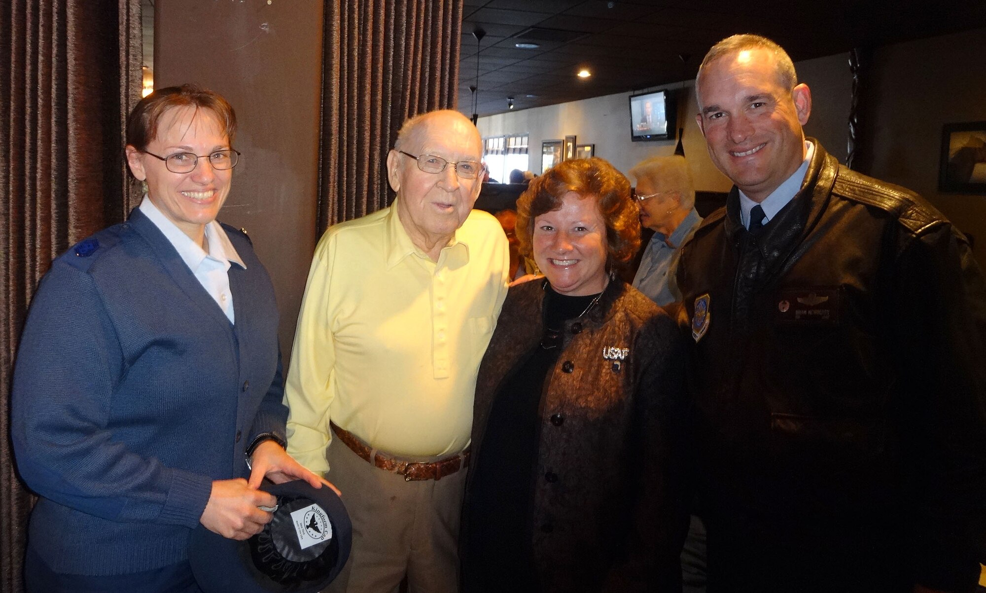 Col. Brian Newberry, 92nd Air Refueling Wing commander, his wife, Jill, and Chief Master Sgt. Wendy Hansen, 92nd ARW command chief, pose for a photo with retired Col. Clyde Owen, last base commander of Larson Air Force Base, during a visit to Moses Lake, Wash., Sept. 23, 2013. During their visit, they were introduced to community citizens, a state senator, state representatives, the city council and the chamber of commerce. (Courtesy photo)