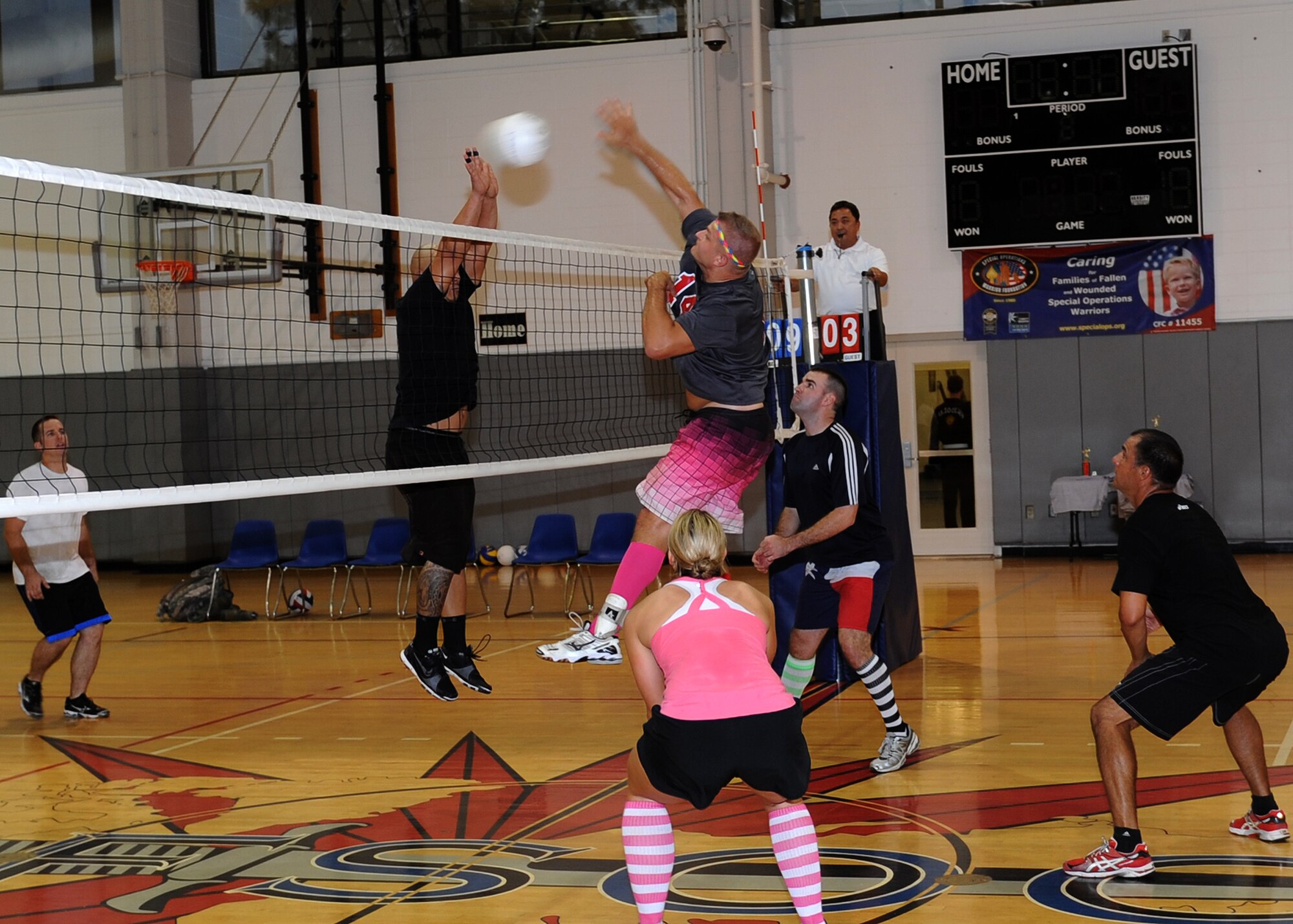 An 801st Special Operations Aircraft Maintenance Squadron player blocks a spike by Stephen Lanzola, 19th Special Operations Squadron team captain, during the Hurlburt Field Intramural Volleyball Tournament Sept. 20, 2013, at Hurlburt Field, Fla. The 801st SOAMXS lost 25-23, 23-25 and 15-12 during the final matchup of the weeklong tournament. (U.S. Air Force photo/ Senior Airman Kentavist P. Brackin)