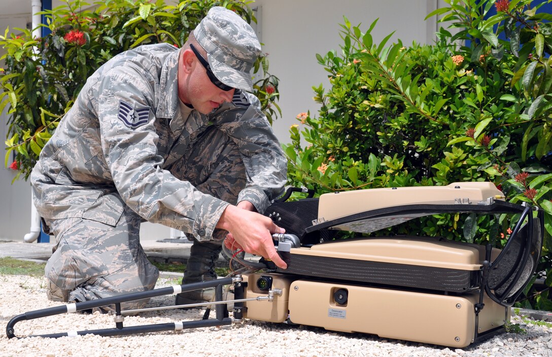 U.S. Air Force Staff Sgt. William Lane sets up a SWE-DISH communication system during a disaster response exercise in Belize, Sept. 26, 2013.  Lane serves on Joint Task Force-Bravo's Central America Survey and Assessment Team and set up the team's tactical communication capabilities for the exercise.  (U.S. Air Force photo by Capt. Zach Anderson)