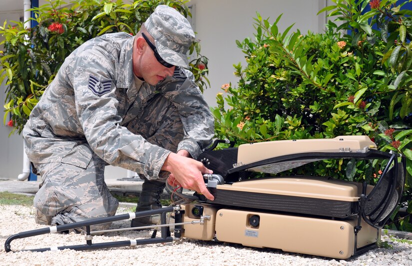 U.S. Air Force Staff Sgt. William Lane sets up a SWE-DISH communication system during a disaster response exercise in Belize, Sept. 26, 2013.  Lane serves on Joint Task Force-Bravo's Central America Survey and Assessment Team and set up the team's tactical communication capabilities for the exercise.  (U.S. Air Force photo by Capt. Zach Anderson)