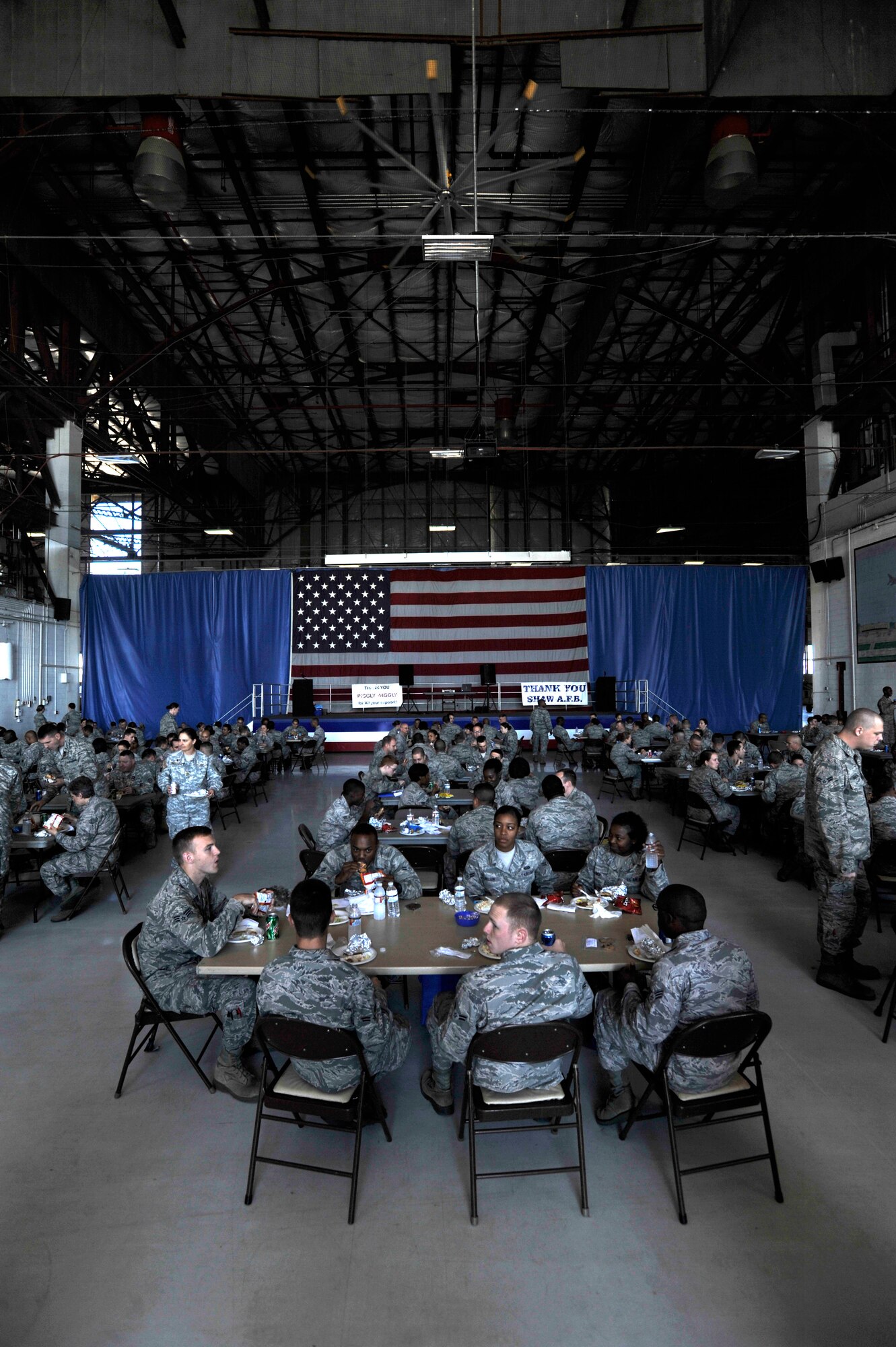 U.S. Air Force Airmen eat lunch during a military appreciation picnic, Shaw Air Force Base, S.C., Sept. 27, 2013. Team Shaw participated in a Comprehensive Airman Fitness day which was followed with a picnic provided by the Sumter community. (U.S. Air Force photo by Airman 1st Class Jensen Stidham/Released)