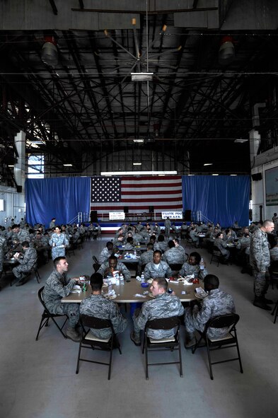U.S. Air Force Airmen eat lunch during a military appreciation picnic, Shaw Air Force Base, S.C., Sept. 27, 2013. Team Shaw participated in a Comprehensive Airman Fitness day which was followed with a picnic provided by the Sumter community. (U.S. Air Force photo by Airman 1st Class Jensen Stidham/Released)