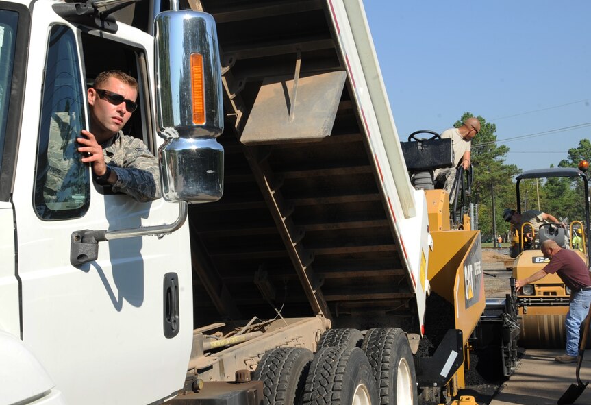Airman 1st Class Jon Martinez, 2nd Civil Engineer Squadron paving and equipment apprentice, waits for further instruction during road construction at the Bodcau gate on Barksdale Air Force Base, La., Sept. 27, 2013.The gate construction is estimated to be completed on Oct. 15, 2013. (U.S. Air Force photo/Senior Airman Sean Martin)