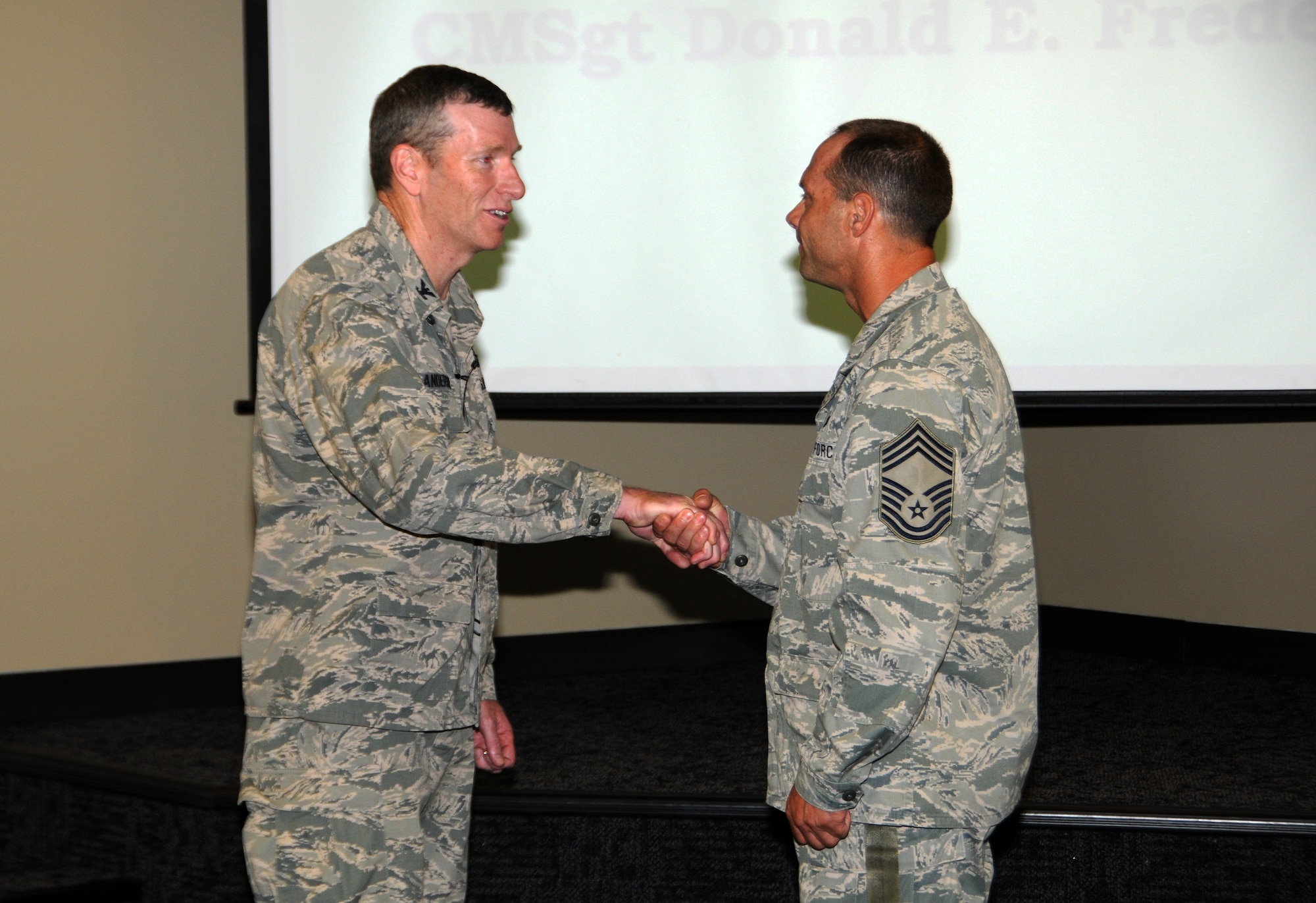 Chief Master Sgt. Donnie Frederick, right, was the winner of the wing level Lance P. Sijan Leadership Award at the 188th Fighter Wing in the senior noncommissioned officer category. Col. Mark W. Anderson, 188th Fighter Wing commander, recognized Frederick for this accolade at a recent commander’s call Sept. 7, 2013. (U.S. Air National Guard photo by Airman 1st Class Cody Martin/188th Fighter Wing Public Affairs)