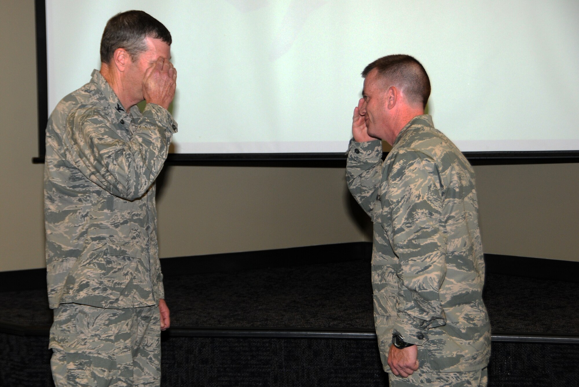 Maj. Jim Garvey, right, was the winner of the wing level Lance P. Sijan Leadership Award at the 188th Fighter Wing in the junior officer category. Garvey was a captain during the award period. Col. Mark W. Anderson, 188th Fighter Wing commander, recognized Garvey for this accolade at a recent commander’s call Sept. 7, 2013. (U.S. Air National Guard photo by Airman 1st Class Cody Martin/188th Fighter Wing Public Affairs)