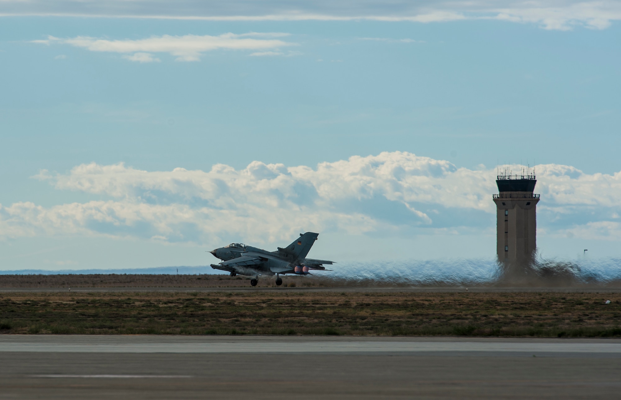 A German Air Force AG-51 Tornado takes to the sky for an Exercise Mountain Roundup 2013 orientation flight at Mountain Home Air Force Base, Idaho, Oct. 1, 2013. The base and the 266th Range Squadron control and maintain emitter sites across almost 7,500-square miles of operational range space, and it's that access to airspace and ranges that allows for realistic, safe training and testing while providing the flexibility to accommodate the complexity of this multinational, multiservice exercise. (U.S. Air Force photo by Master Sgt. Kevin Wallace/RELEASED)