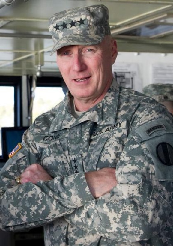 U.S. Army Gen. Robert Cone, Training and Doctrine Command commanding general, spoke about TRADOC's plans for the next fiscal year during a town hall meeting at Fort Eustis, Va., Sept. 18, 2013. Topics included how cuts to the Department of the Army's budget may affect TRADOC, the command's numerous accomplishments and the future of the organization. (courtesy photo)