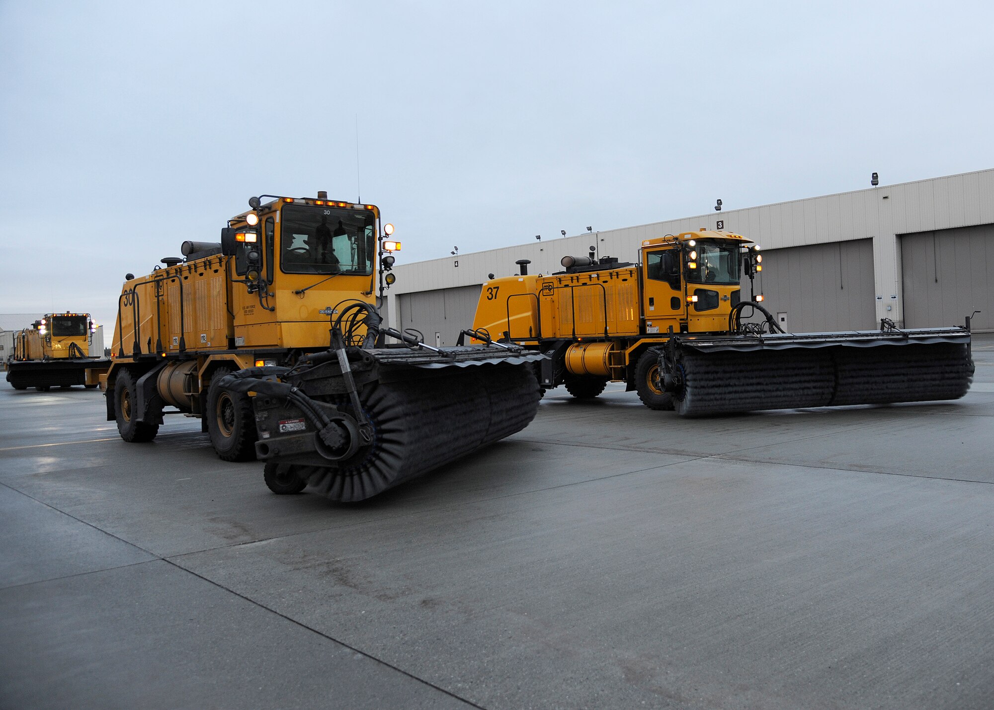 Heavy equipment operators from the 354th Civil Engineer Squadron practice driving a snow broom during Snow School Sept. 26, 2013, Eielson Air Force Base, Alaska. Eielson’s Snow Barn is responsible for clearing 112 miles of paved and unpaved roads during the winter season. (U.S. Air Force photo by Senior Airman Ashley Nicole Taylor/Released)
