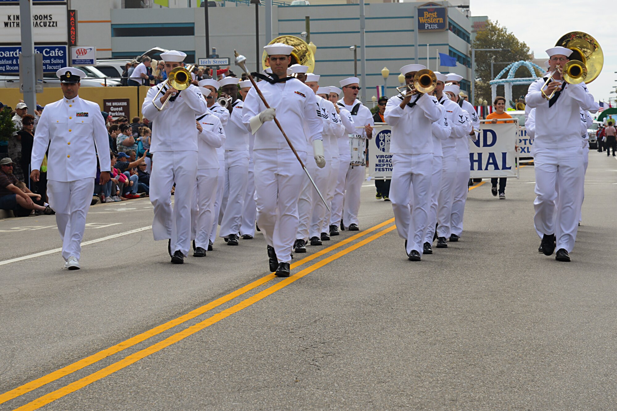 Sailors of the U.S. Fleet Forces Band march in the Neptune Festival Grand Parade in Virginia Beach, Va., Sept. 28, 2013. The annual event was free and open to the public to enhance family values and togetherness of the community. (U.S. Air Force photo by Airman 1st Class Victoria H. Taylor/ Released)