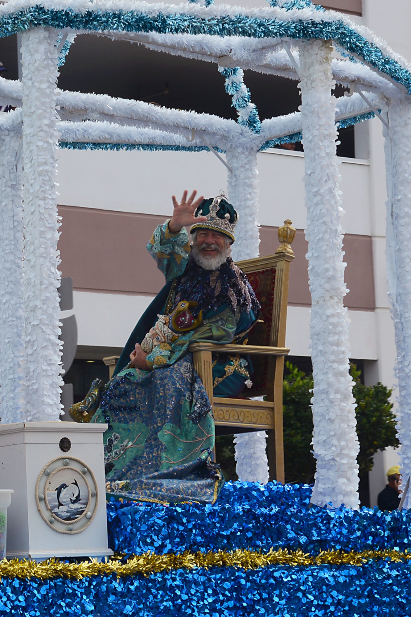 An actor portraying “King Neptune” rides aboard a float during the Neptune Festival Grand Parade in Virginia Beach, Va., Sept. 28, 2013. The annual festival showcased the unique heritage and location of Virginia Beach as a “city by the sea.” (U.S. Air Force photo by Airman 1st Class Victoria H. Taylor/ Released)