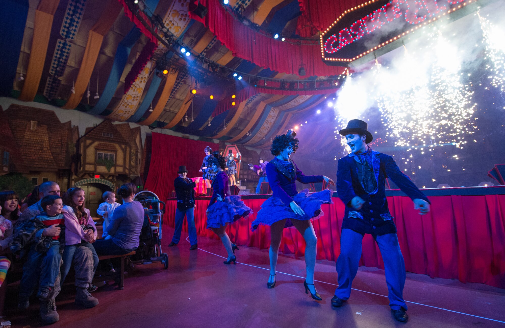 U.S. Air Force Staff Sgt. Kenneth Taiclet, 633rd Communications Squadron client systems technician, and his family watch the finale of the Halloween-themed show at Busch Gardens in Williamsburg, Va., Sept. 28, 2013. After the longest deployment of his 15-year career, the Airman surprised his children when he returned one week early from his deployment. (Courtesy photo/Released)
