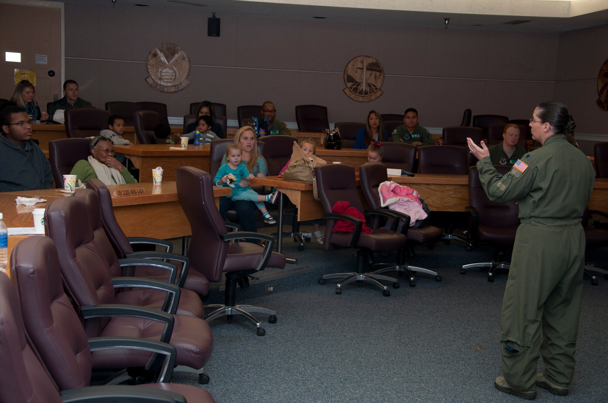 130928-F-GP871-025 - Lt. Col. Cynthia Gunderson, 321st Missile Squadron commander, provides a mission and history briefing to 321 MS members and their family in the 90th Operations Group Sept. 28, 2013. The 321 MS hosted a “green carpet day” to familiarize families with the duties and responsibilities of their loved ones. The day included a tour of the MPT, a mission and history briefing by Lt. Col. Cynthia Gunderson, 321st MS commander, a trip to a missile alert facility and a BBQ lunch. (U.S. Air Force photo/TSgt Stacy Foster)