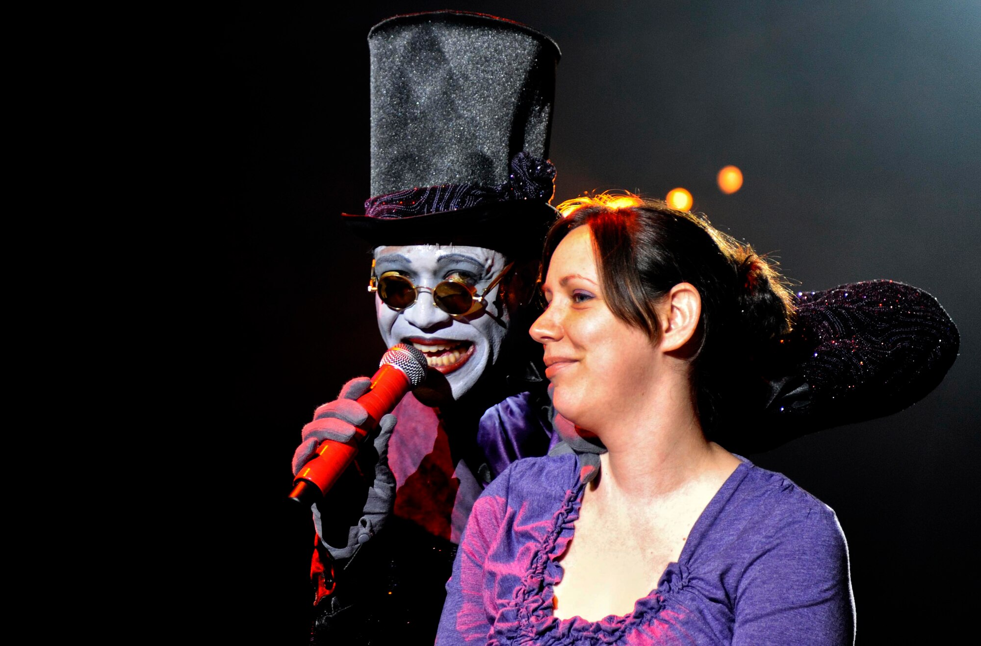Melissa Taiclet, wife of U.S. Air Force Staff Sgt. Kenneth Taiclet, was brought on stage during a Halloween-themed show at Busch Gardens in Williamsburg, Va., Sept. 28, 2013. Melissa was included in the show in a ploy to help her husband surprise their children when he returned early from a deployment. (U.S. Air Force photo by Airman 1st Class R. Alex Durbin/Released)