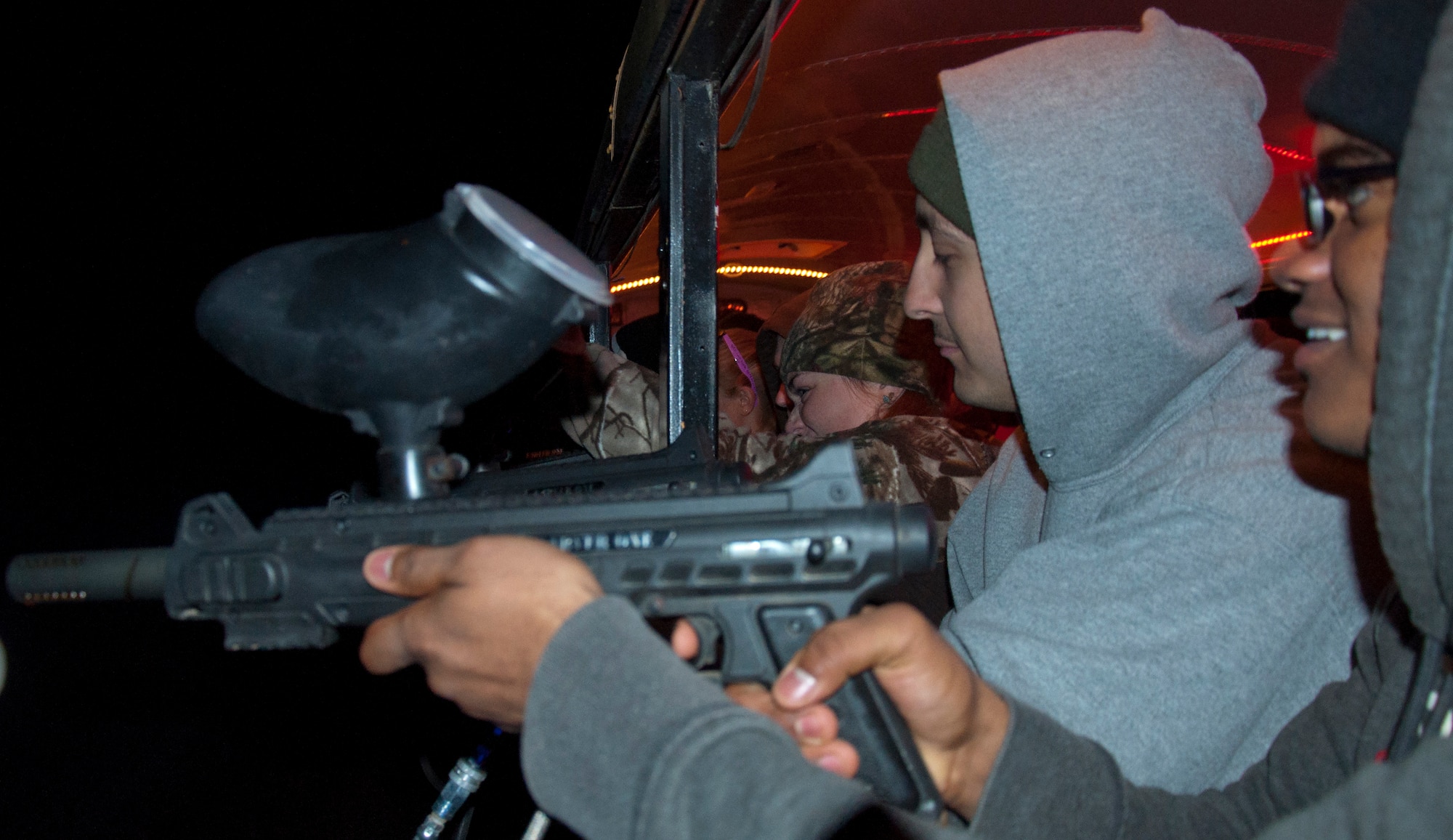 130928-F-GZ967-038 Kelly Palmer, Outdoor Recreation employee, Brent Palmer and Kenya Robinson, 90th Civil Engineer Squadron, take aim as they try to protect the Fritzler Corn Maze from a horde of “zombies” Sept. 28, 2013. (U. S. Air Force photo by Airman 1st Class Brandon Valle)