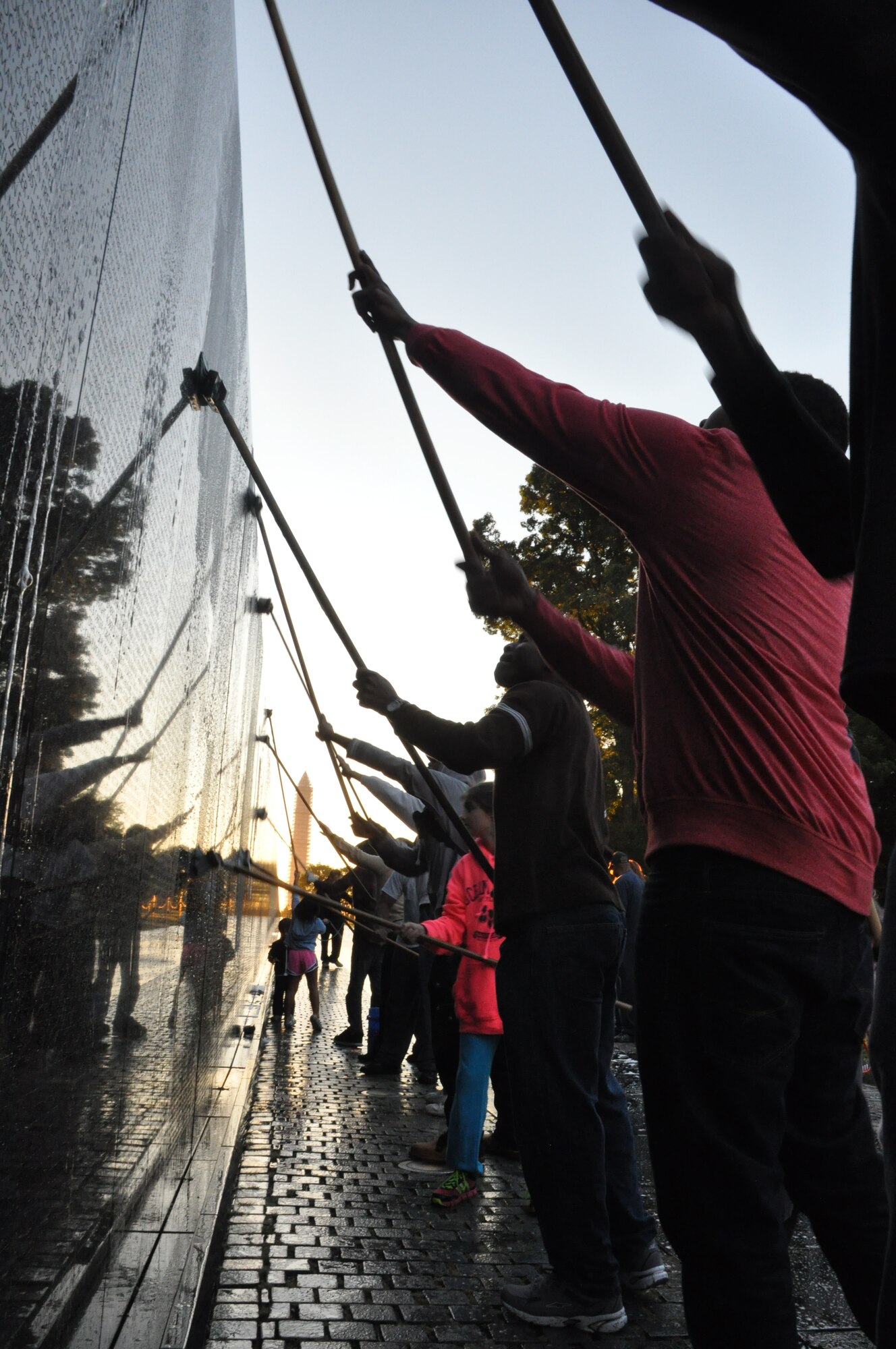 Airmen and their families from the 459th Air Refueling Wing at Joint Base Andrews, Md., wash the wall at the Vietnam Memorial, Washington D.C., September 28, 2013. The wall washing is a volunteer effort to keep national monuments clean and maintained. (U.S. Air Force photo/ Staff Sgt. Katie Spencer) 