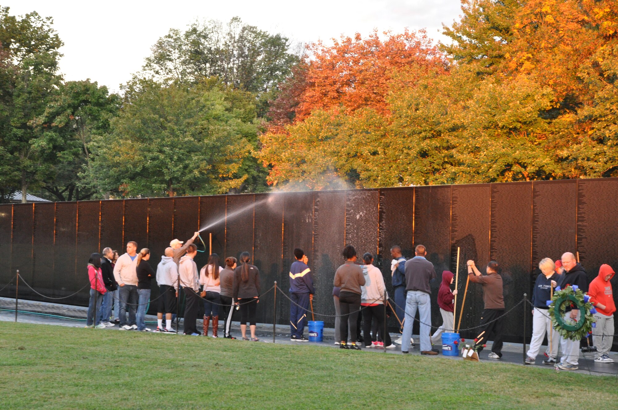 Airmen and their families from the 459th Air Refueling Wing at Joint Base Andrews, Md., wash the wall at the Vietnam Memorial, Washington D.C., September 28, 2013. The wall washing is a volunteer effort to keep national monuments clean and maintained. (U.S. Air Force photo/ Staff Sgt. Katie Spencer)