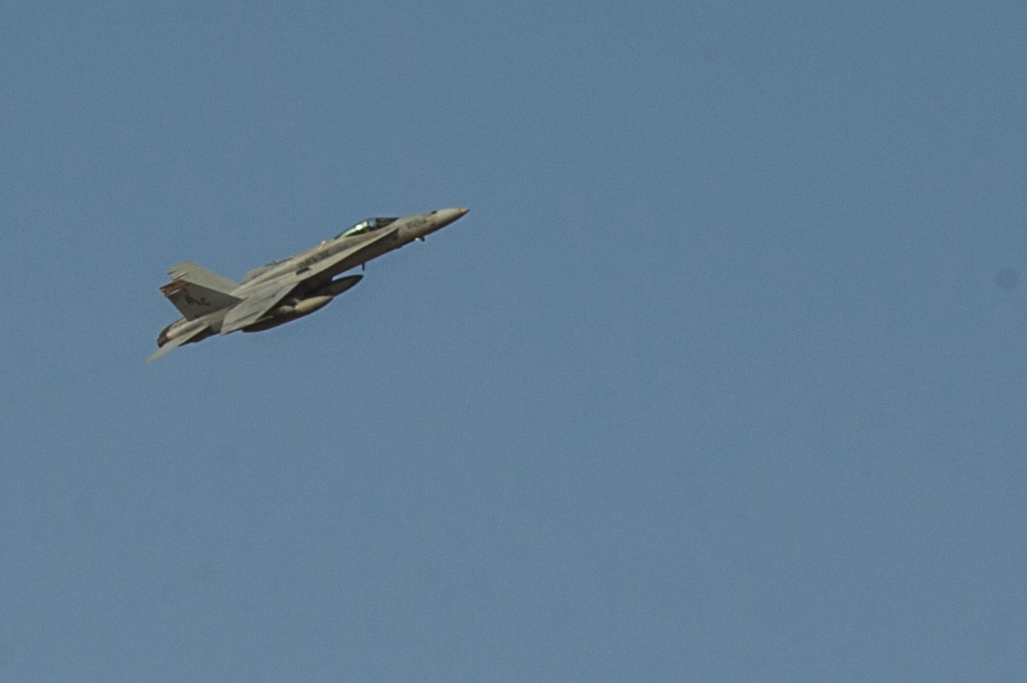 U.S. Navy F/A-18C Hornet, based on aircraft carrier USS Harry Truman, participates in an air-to-ground exercise with the 82nd Expeditionary Air Support Operations Squadron at an undisclosed location in Southwest Asia, Sept. 16, 2013. The 82nd EASOS is an Air Force unit that provides air-to-ground and weather expertise to the U.S. Army Central Task Force. (U.S. Air Force photo by Staff Sgt. Stephany Richards)
