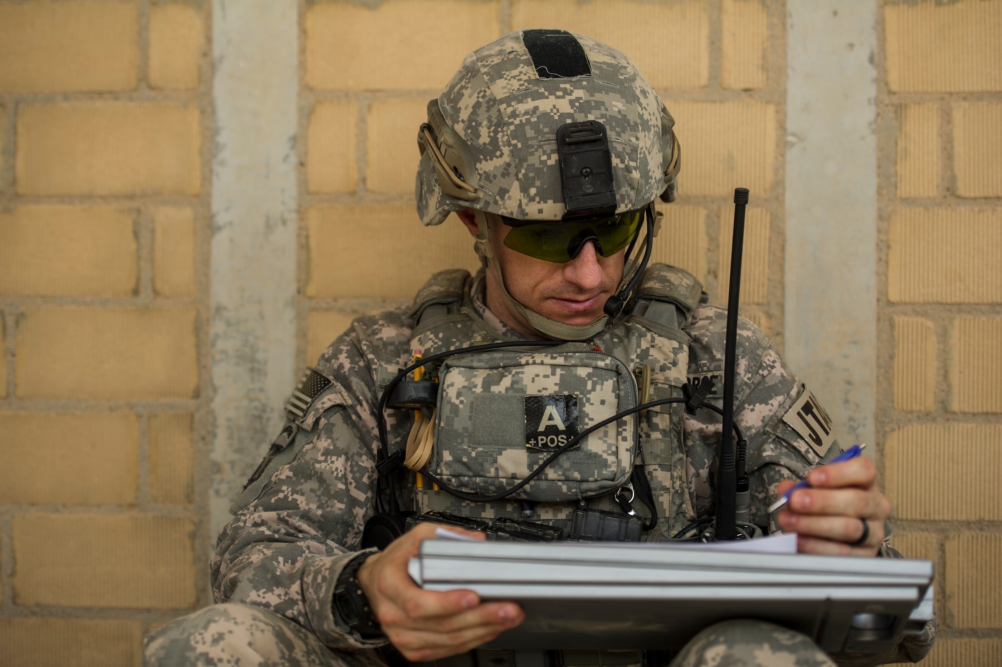 U.S. Air Force Staff Sgt. James DeMars, 82nd Expeditionary Air Support Operations Squadron joint terminal attack controller, evaluates the JTAC controlling the Joint Air Attack Team live-fire exercise at an undisclosed location in Southwest Asia, Sept. 18, 2013. A JAAT is where both fixed wing and rotary wing assets all fire in to the same area. The 82nd EASOS is an Air Force unit that provides air-to-ground and weather expertise to the U.S. Army Central Task Force. (U.S. Air Force photo by Staff Sgt. Stephany Richards)
