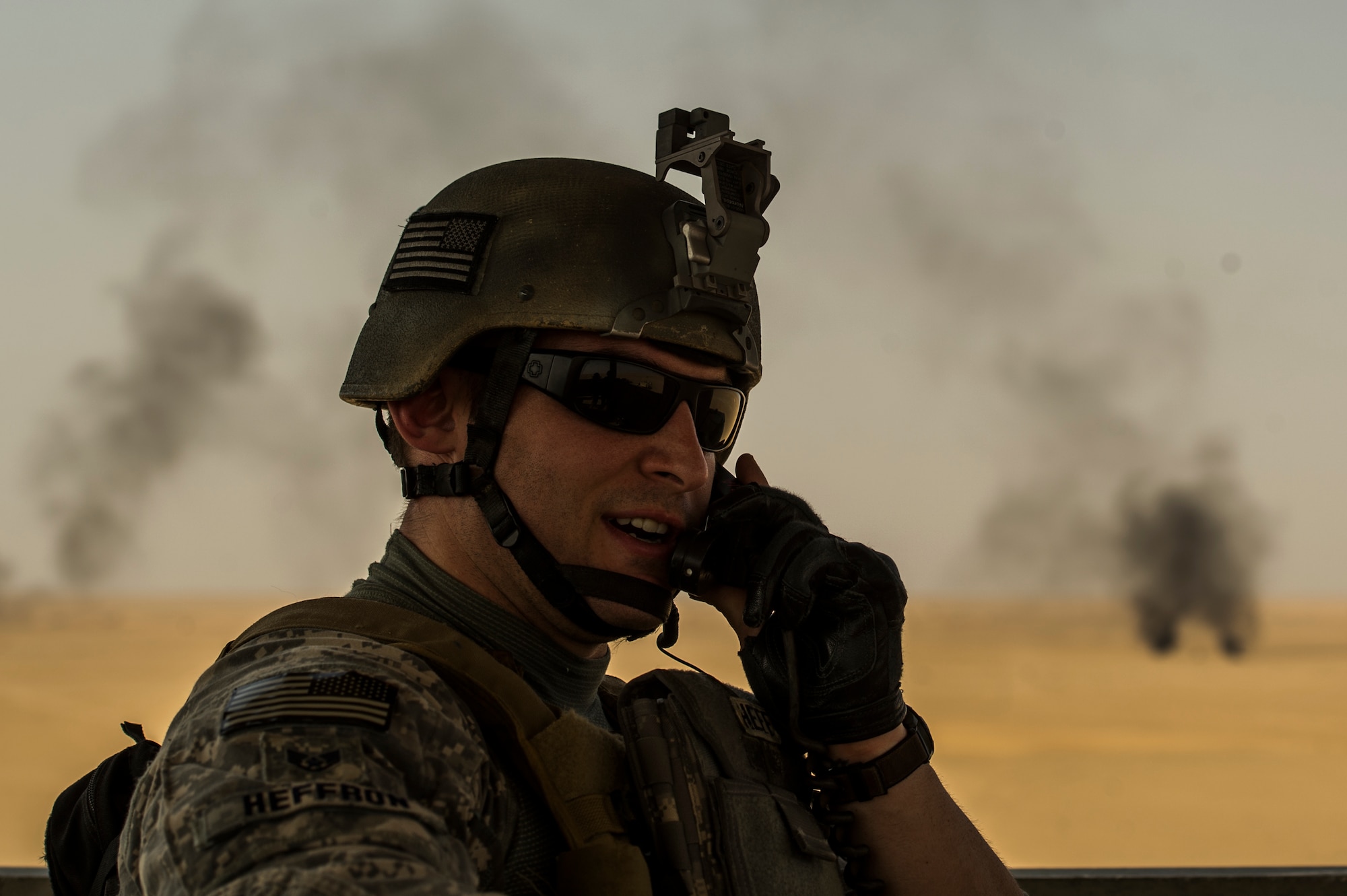 U.S. Air Force Staff Sgt. Nick Heffron, 82nd Expeditionary Air Support Operations Squadron joint terminal attack controller, talks to F-15E Strike Eagle pilots during a Joint Air Attack Team live-fire exercise at an undisclosed location in Southwest Asia, Sept. 18, 2013. A JAAT is where both fixed wing and rotary wing assets all fire in to the same area. "The good thing about working with the sister services on this is the more you know how they operate the more proficient you will be." (U.S. Air Force photo by Staff Sgt. Stephany Richards)