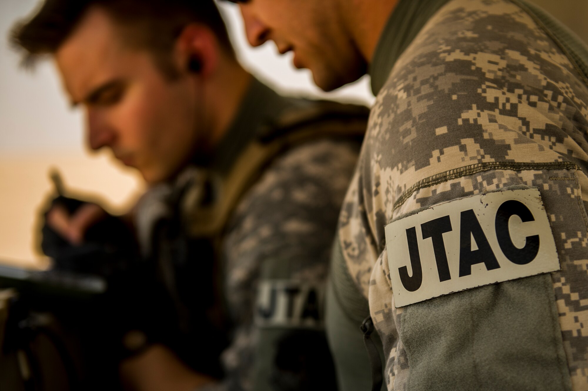 U.S. Air Force Senior Airman Casey Richards, Staff Sgt. Nick Heffron and Staff Sgt. Jedidiah Pearson, 82nd Expeditionary Air Support Operations Squadron joint terminal attack control party operators, prepare for a Joint Air Attack Team live-fire exercise at an undisclosed location in Southwest Asia, Sept. 18, 2013. A JAAT is where both fixed wing and rotary wing assets all fire in to the same area. "Our job is great because it saves a lot of lives." (U.S. Air Force photo by Staff Sgt. Stephany Richards)

