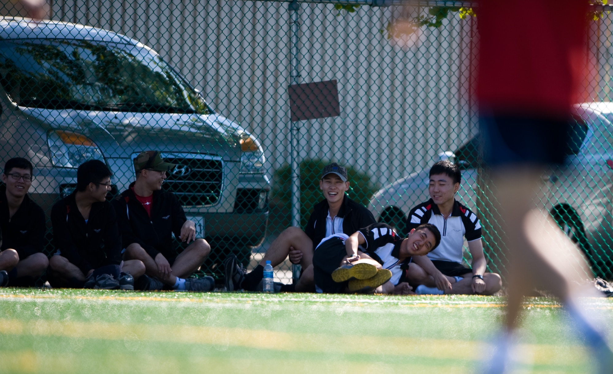 Republic of Korea airmen watch during the base team’s soccer game at Kunsan Air Base, Republic of Korea, Sept. 27, 2013. Airmen from both the U.S. and ROK air forces competed in sports during the 2013 Korean and American Friendship Day. (U.S. Air Force photo by Senior Airman Armando A. Schwier-Morales/ Released)