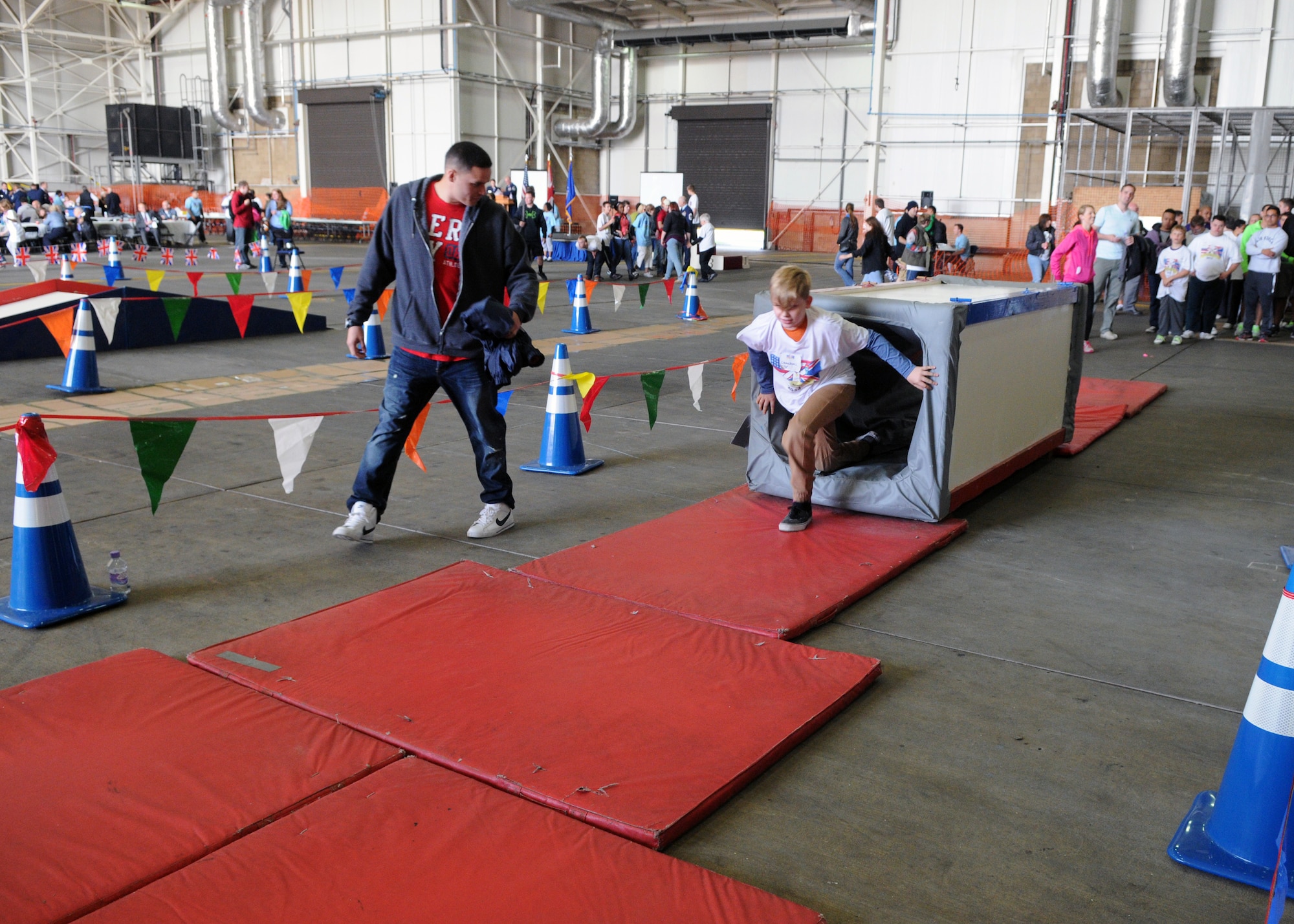 Joan Mann Special Sports Day athlete, Cameron Taylor, participates in an obstacle course Sept. 28, 2013, on RAF Mildenhall, England. The sports day is designed for special-needs adults and children of England. (U.S. Air Force photo by Airman 1st Class Jonathan Light/Released)