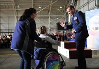 U.S. Air Force Col. Kenneth T. Bibb Jr., 100th Air Refueling Wing commander, gives a high-five to an athlete Sept. 28, 2013, on RAF Mildenhall, England, during the 32nd annual Joan Mann Special Sports Day event. The sports day tradition began when Joan Mann, a Ministry of Defence employee who worked in the public affairs office on RAF Mildenhall, sought a way to bring the community together and work with special-needs citizens. (U.S. Air Force photo by Airman 1st Class Kyla Gifford/Released)