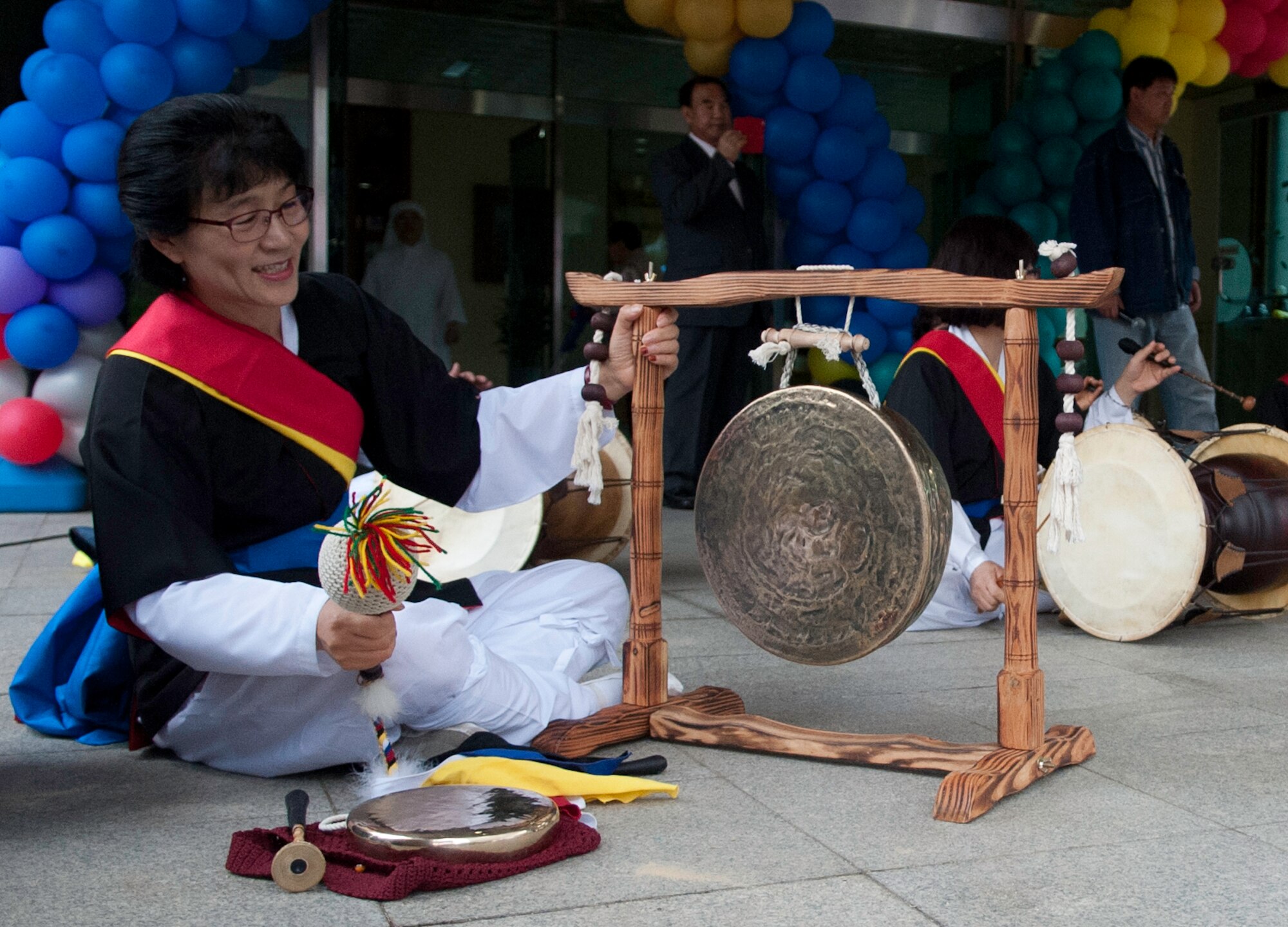 A traditional Korean musician plays for the crowd at the Mount Saint Joseph Home for the Aged family day in Jeonju, Republic of Korea, Sept. 28, 2013. Airmen from the 8th Fighter Wing voluteered throughout the day visiting with residents and families. (U.S. Air Force photo Tech. Sgt. Alex Griffin/Released)