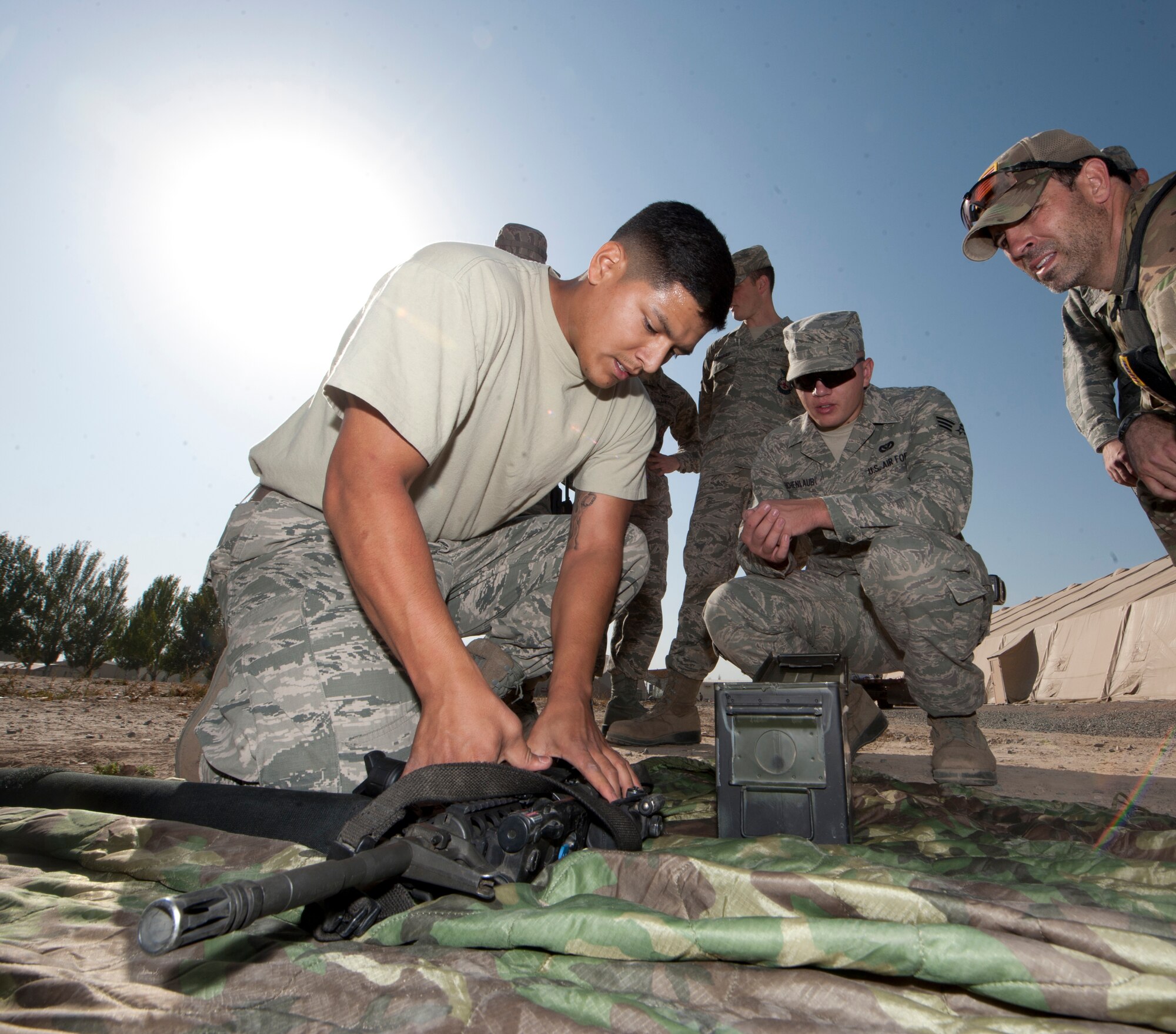 Senior Airman Jamie Oseguera, 376th Expeditionary Security Forces Squadron entry controller, puts together an M-4 rifle during "Battle of the Badges" at Transit Center at Manas, Krygyzstan, Sept. 26, 2013. Oseguera is deployed out of Hansom Air Force Base, Mass., and is a native of Hughson, Calif. (U.S. Air Force photo/Staff Sgt. Robert Barnett)