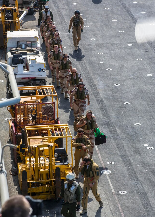 French Forces leadership from Djibouti, tour the USS Kearsarge (LHD 3), at sea, Sept. 30, 2013. The 26th Marine Expeditionary Unit (MEU) is a Marine Air-Ground Task Force forward-deployed to the U.S. 5th and 6th Fleet areas of responsibility aboard the Kearsarge Amphibious Ready Group serving as a sea-based, expeditionary crisis response force capable of conducting amphibious operations across the full range of military operations. (U.S. Marine Corps photo by Sgt. Christopher Q. Stone, 26th MEU Combat Camera/Released)