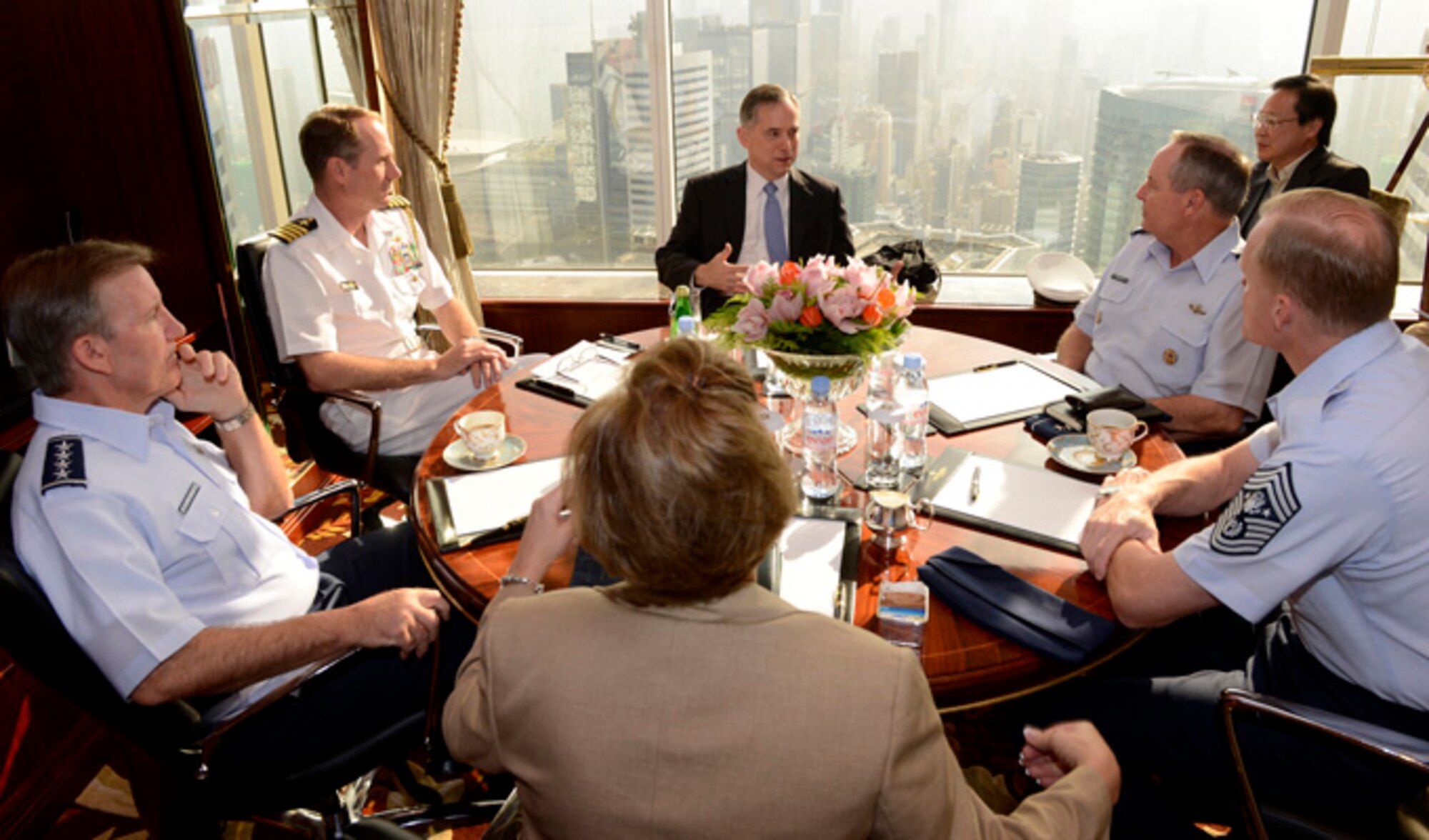 Clifford Hart, U.S. consul general in Hong Kong, speaks with Gen. Mark A. Welsh III, Air Force chief of staff, Gen. “Hawk” Carlisle, Pacific Air Forces commander, Heidi Grant, deputy under secretary of the Air Force for International Affairs, and Chief Master Sgt. of the Air Force James Cody, about the unique environment in Hong Kong Sept. 29, 2013.  The meeting was part of a weeklong visit to China, which involved meetings with military counterparts and other civil and political leadership in Beijing, Hangzhou and Hong Kong.