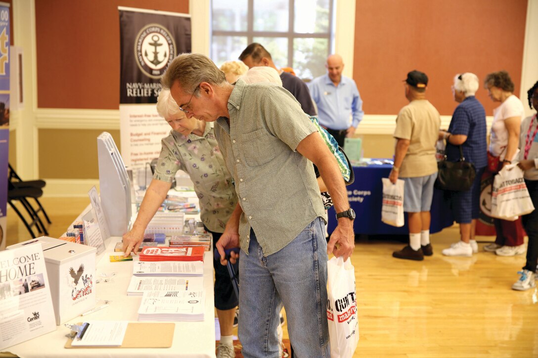 Retirees browse booths set up by various service providers to suit their needs at the Retiree Appreciation Day at Marston Pavilion aboard Marine Corps Base Camp Lejeune, Sept. 28. Medical services, including flu shots, blood pressure checks and dental exams were also offered to retirees.