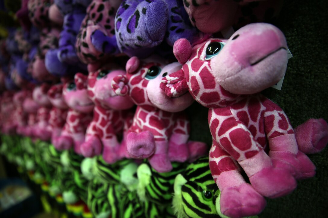 Stuffed animals line the walls of attractions during the Onslow County Fair, Sept. 30. The fair started Monday and is slated to wrap up Friday night.