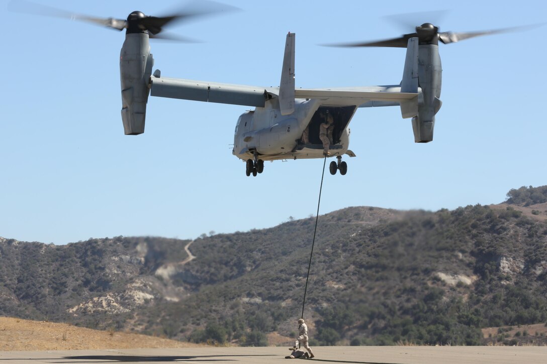 MARINE CORPS BASE CAMP PENDLETON, Calif. -- An MV-22B Osprey with Marine Medium Tiltrotor Squadron 161 "GreyHawks"  stablizes itself as multiple infantry and reconnaissance units conduct fast roping excercises aboard Marine Corps Base Camp Pendleton, Calif., Oct. 1. The units conduct the fast roping excercise to familarize the units with rotor wash of the Osprey.
