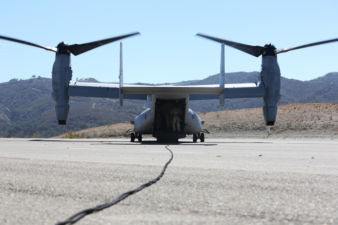 MARINE CORPS BASE CAMP PENDLETON, Calif. -- An MV-22B Osprey with Marine Medium Tiltrotor Squadron 161 "GreyHawks"  waits to lift off as members from multiple uniits board the aircraft to conduct fast roping excercises aboard Marine Corps Base Camp Pendleton Calif., Oct 1. The units practice with the Osprey due to the differences in the rotor wash compared to other rotary aircraft.