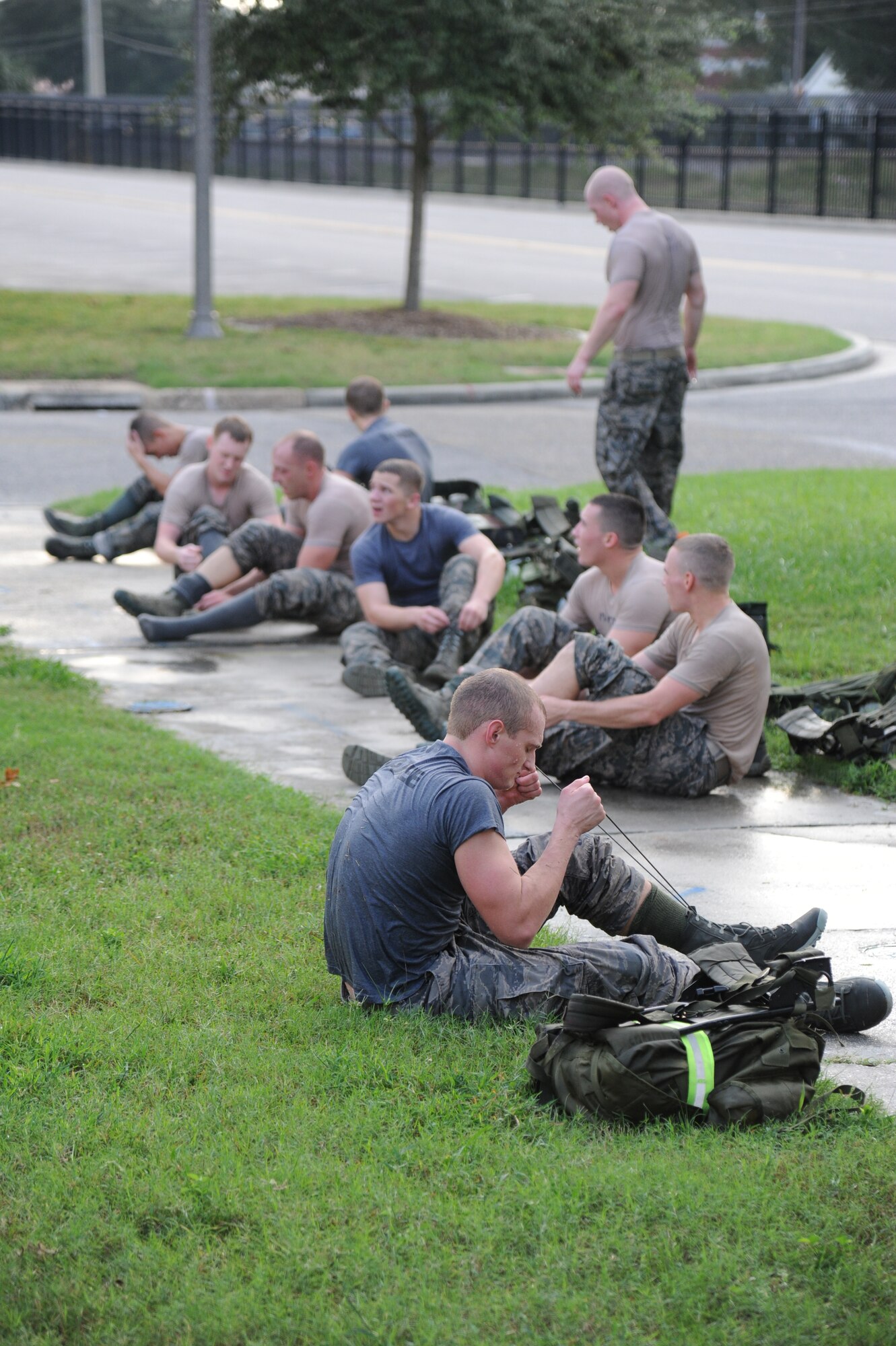 Members of the 334th Training Squadron combat controllers and the 335th Training Squadron special operations weather team transition from swimming laps in the Triangle pool to running during a memorial physical training session Sept. 27, 2013, at Keesler Air Force Base, Miss.  The PT event was in memory of combat controller Senior Airman Mark Forester who was killed in action on Sept. 29, 2010. (U.S. Air Force photo by Kemberly Groue)