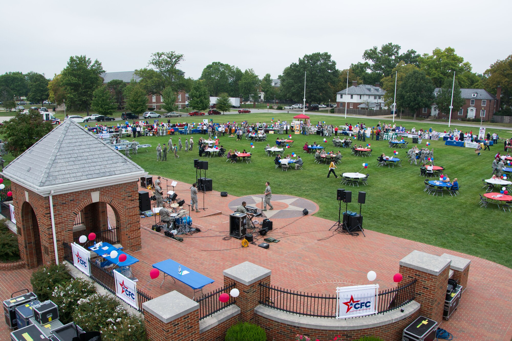 Scott Air Force Base members enjoy lunch and look at charity booths during the Combined Federal Campaign kick-off event Oct. 1, 2013, Scott AFB, Ill. Scott AFB members were given the opportunity to teract with volunteers from a number of charities and learn more about their organizations. (U.S. Air Force photo/Staff Sgt. Jonathan Fowler)