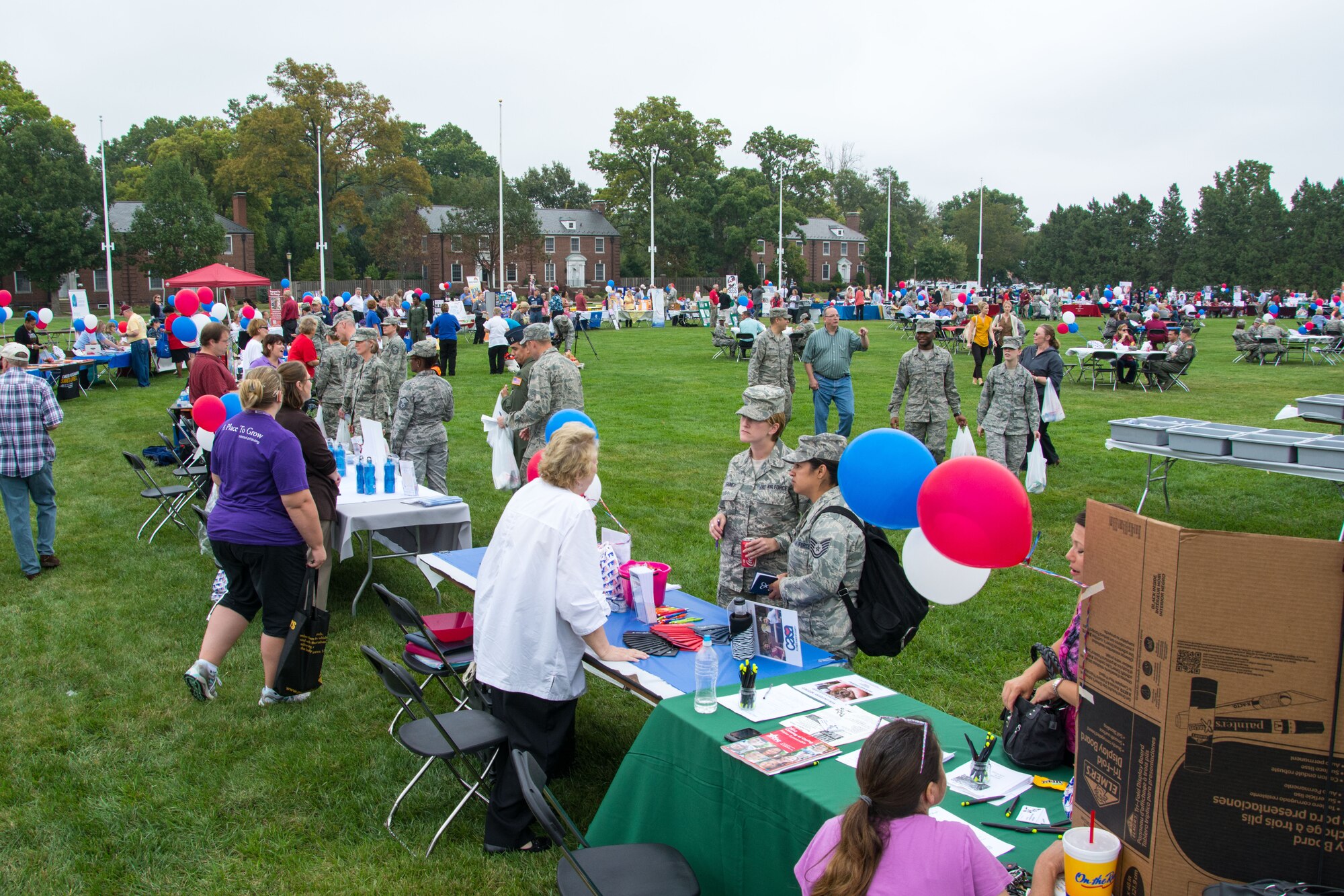 Scott Air Force Base members enjoy lunch and look at charity booths during the Combined Federal Campaign kick-off event Oct. 1, 2013, Scott AFB, Ill. The event had more than 140 volunteers from various charity oranizations providing information to service members, their families and civilians. (U.S. Air Force photo/Staff Sgt. Jonathan Fowler)