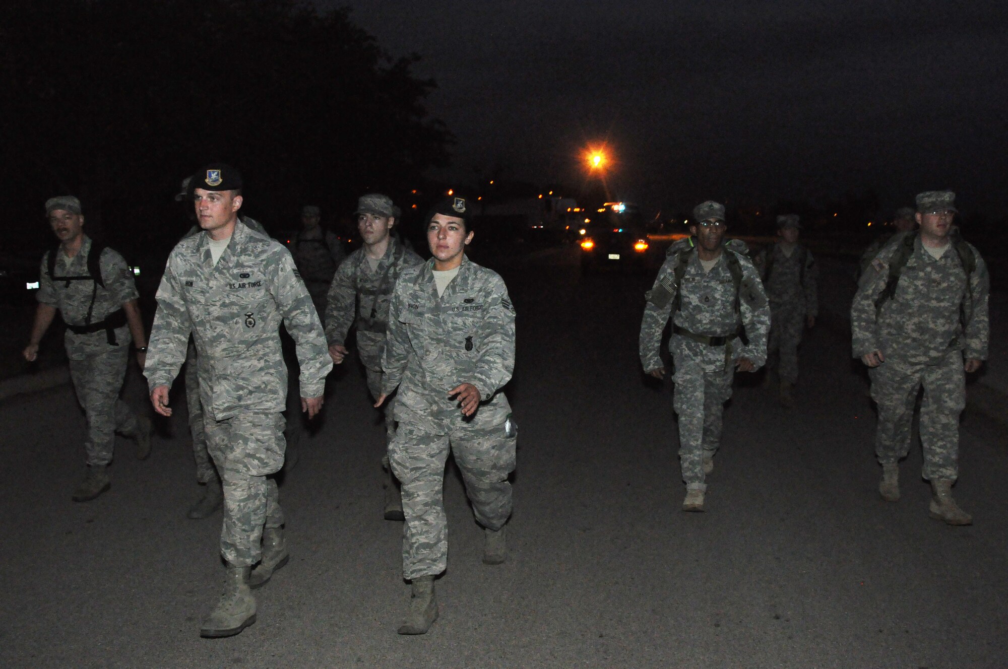 GOODFELLOW AIR FORCE BASE, Texas – A group of Airmen and Soldiers walk down Apache Trail during the Airman 1st Class Elizabeth Jacobson 4.1 Mile Remembrance Ruck March Sept. 28. Jacobson was the first female Airman killed in Operation Iraqi Freedom and the first security forces member killed in combat since 1975. (U.S. Air Force photo/ Airman 1st Class Joshua Edwards)