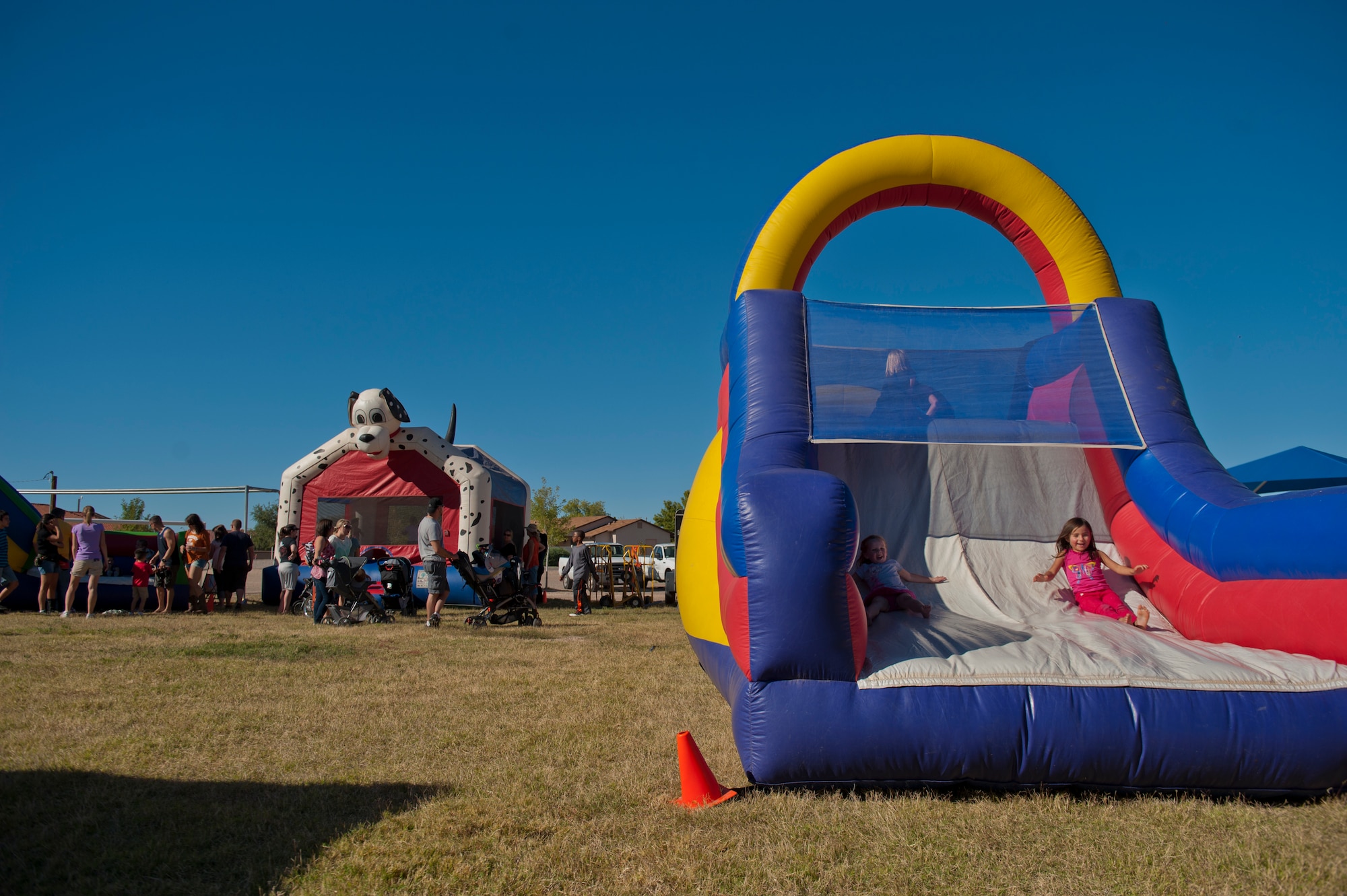 Members of Team Holloman and Alamogordo residents participate in the annual National Night Out event hosted by Soaring Heights Communities at Holloman Air Force Base, N.M., Oct. 1. During the event, local vendors offered free food and beverages. Soaring Heights also set up activities for children and raffled off prizes. (U.S. Air Force photo by Airman 1st Class Aaron Montoya/Released)