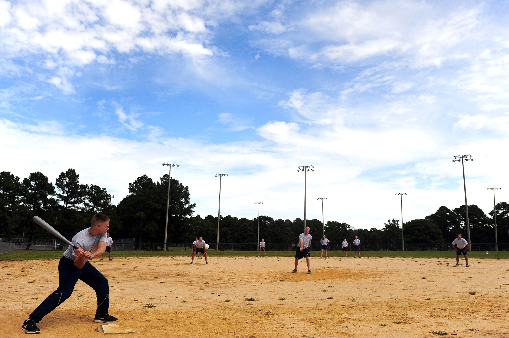U.S. Air Force Airmen assigned to the 4th Force Support Squadron play softball during Comprehensive Airman Fitness (CAF) Day, Sept. 30, 2013. Units throughout the 4th Fighter Wing were encouraged by wing leaders to enhance resiliency by spending time away from their workplaces and focus on the social, mental, physical and spiritual pillars of CAF. (U.S. Air Force photo by Airman 1st Class Brittain Crolley)