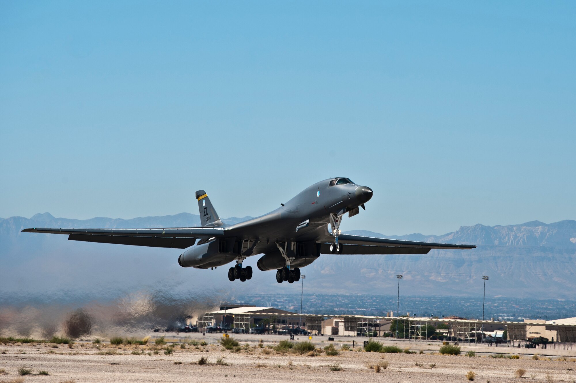 A B-1B Lancer assigned to the 37th Bomb Squadron, Ellsworth Air Force Base, S.D., takes off during Green Flag 14-2 at Nellis AFB, Nev. Green-Flag West provides realistic close-air support training environment for forces preparing to support worldwide combat operations. (U.S. Air Force photo by Airman 1st Class Christopher Tam)