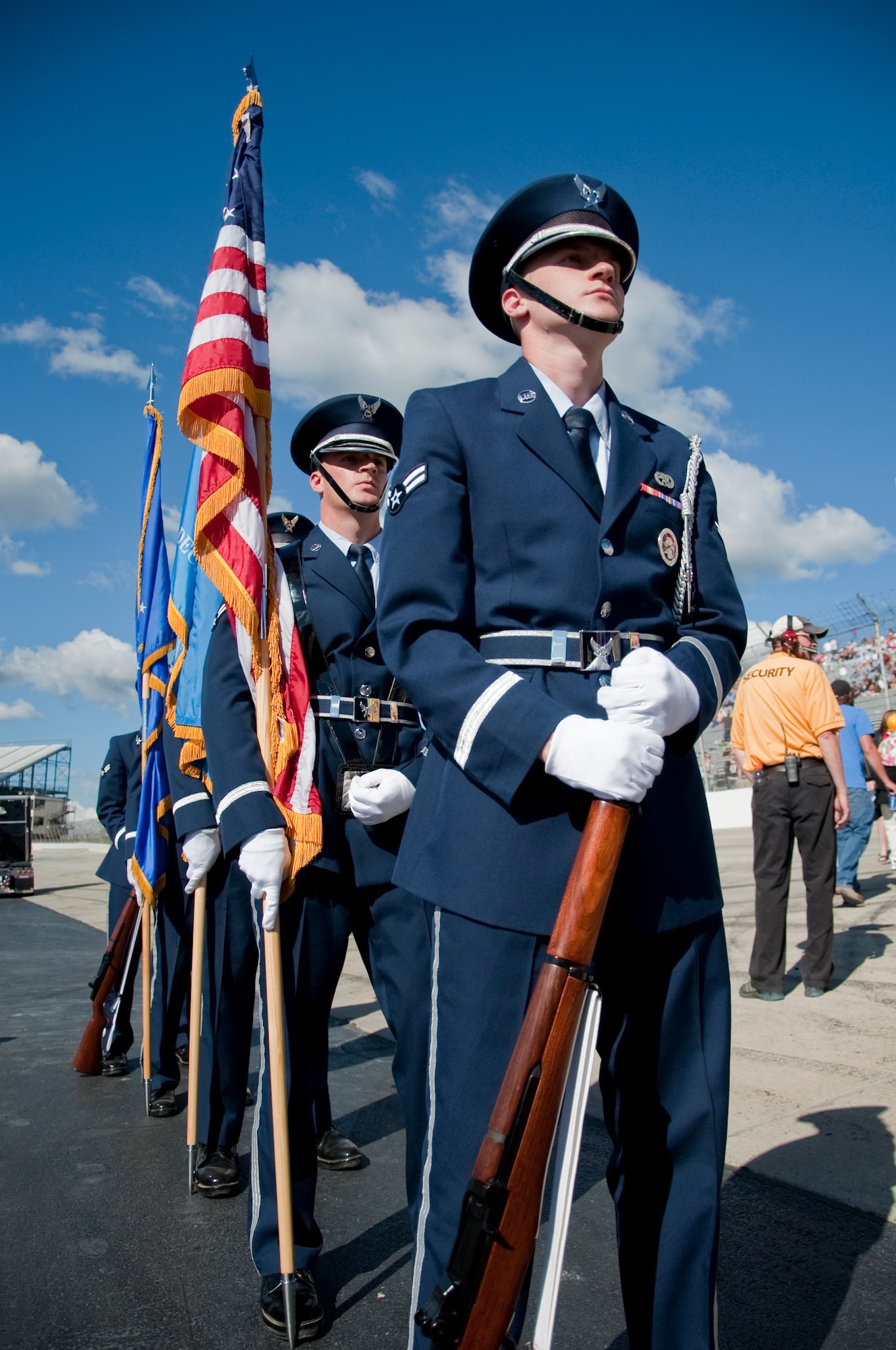 Team Dover honor guard members stand at attention during pre-race ceremonies before the start of the 5-Hour Energy 200 Sept. 28, 2013, at Dover International Speedway in Dover, Del. The honor guard presented the colors during the National Anthem. (U.S. Air Force photo/Senior Airman Jared Duhon)