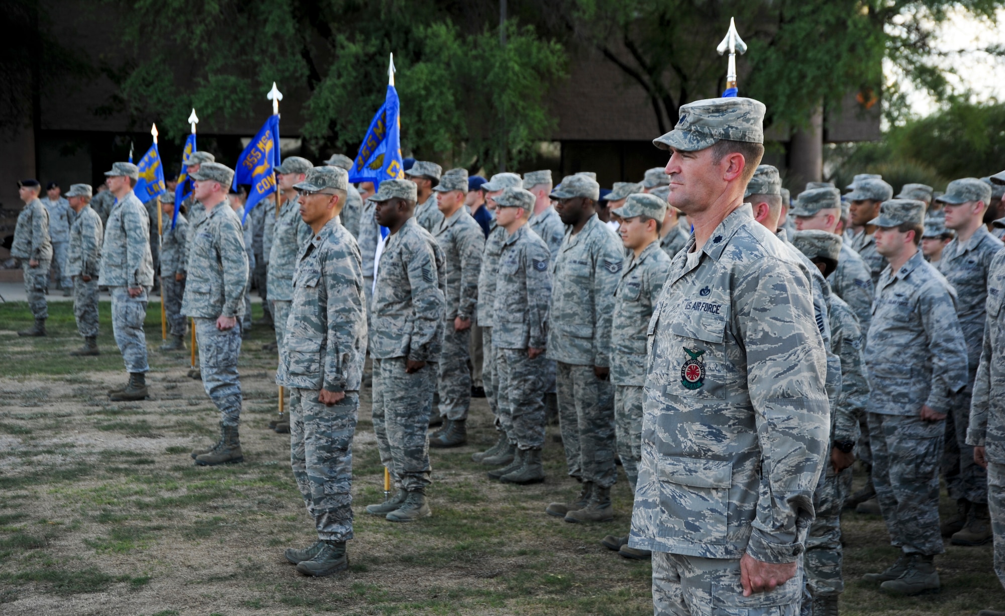 U.S. Air Force 355th Mission Support Group squadron commanders stand at attention during a 355th MSG retreat at Davis-Monthan Air Force Base, Ariz., Sept. 26, 2013. At the first note of "Retreat" all military personnel must come to the position of attention and face the flag or the direction the music is coming from if the flag is not visible. (U.S. Air Force photo by Senior AirmanJustin Veazie/Released)