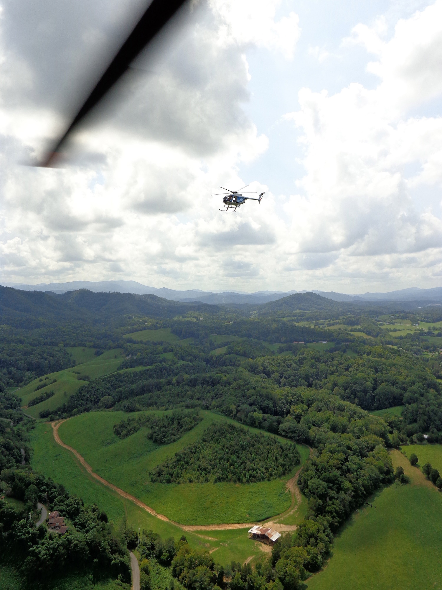 An aerial view from one ERAD aircraft shows a second aircraft conducting marijuana searches in East Tennessee. (photo by DEA special agent)